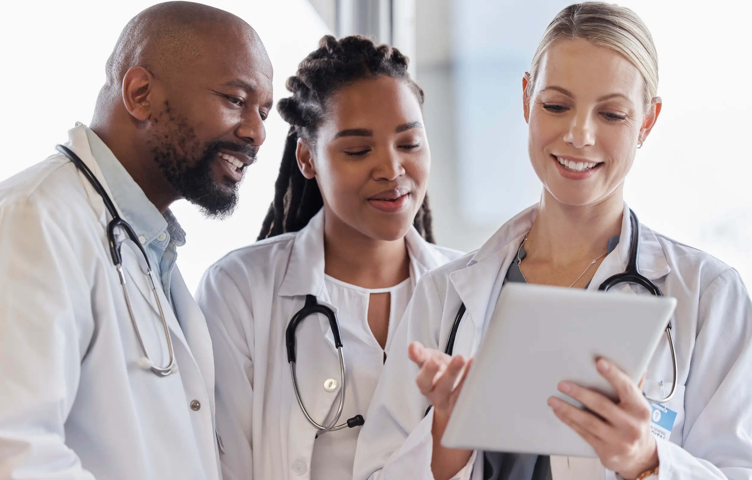 medical professionals collaborate using tablet in 2026