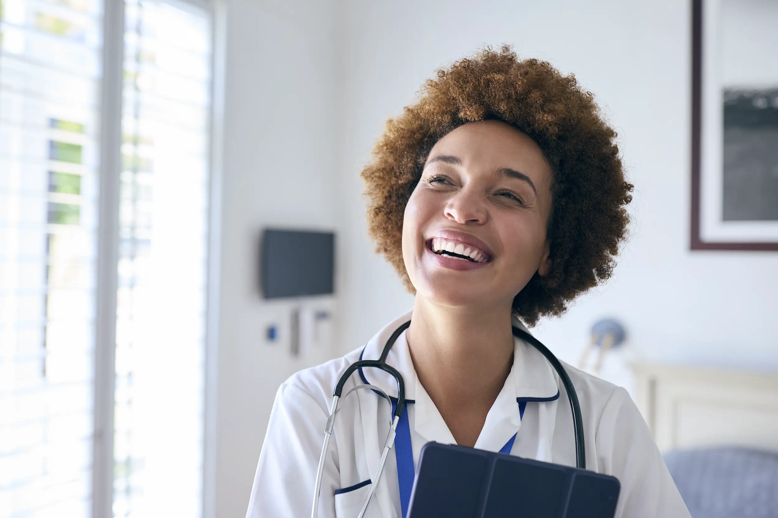 portrait of smiling female nurse wearing uniform w 2026