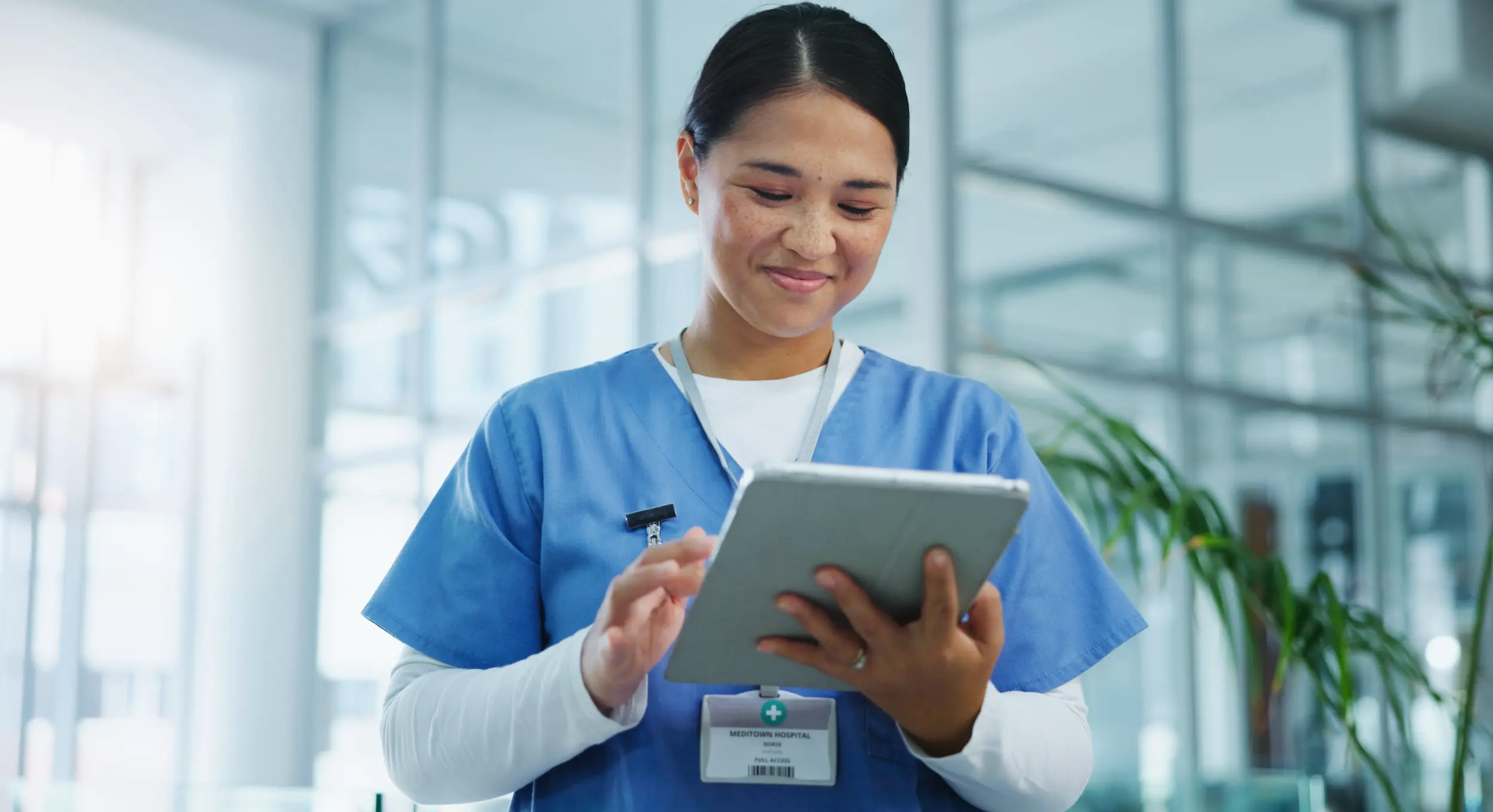 woman healthcare worker using digital tablet in ho 2026